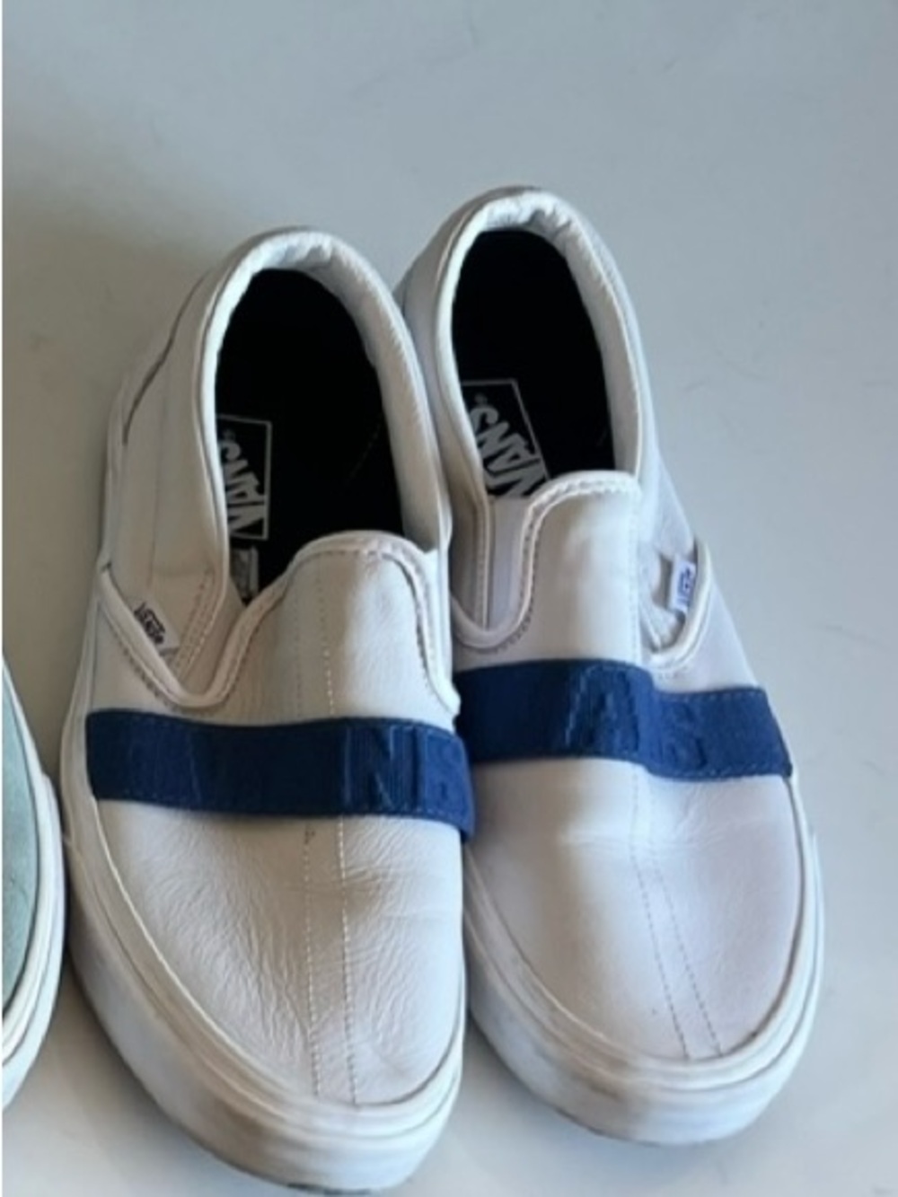 Vans White Slip-On Sneakers with Navy Blue Strap